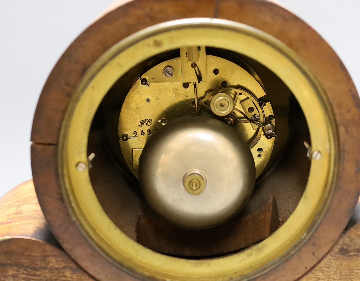 A 19th century walnut drum head mantel clock, 52 cms wide